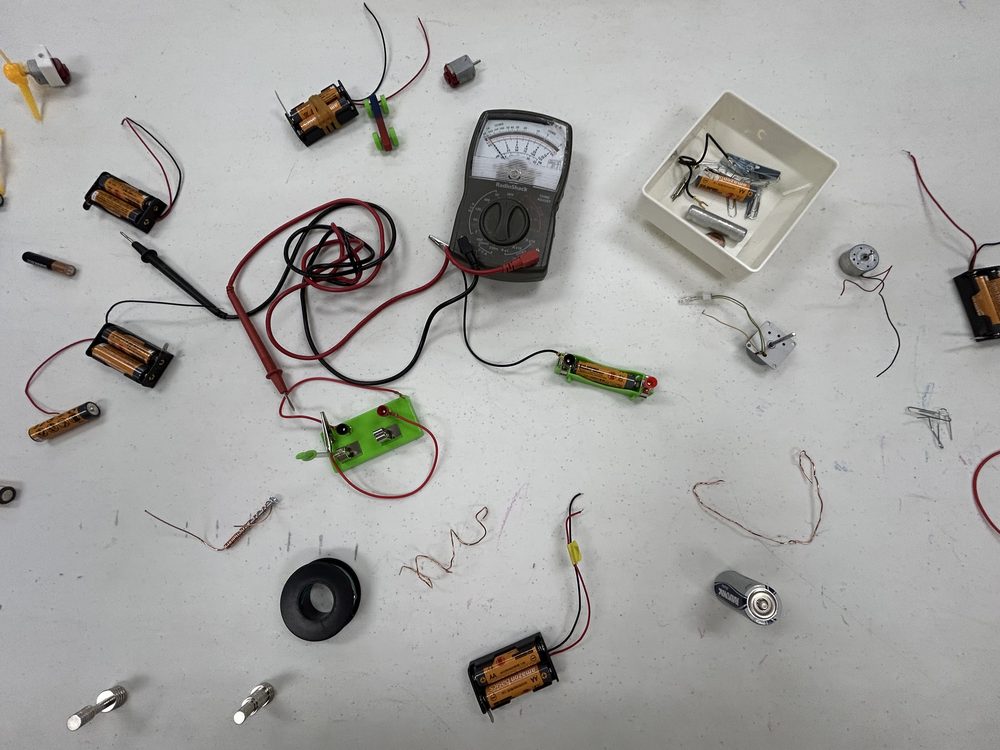 Electricity and circuit-building materials laid out for a lesson